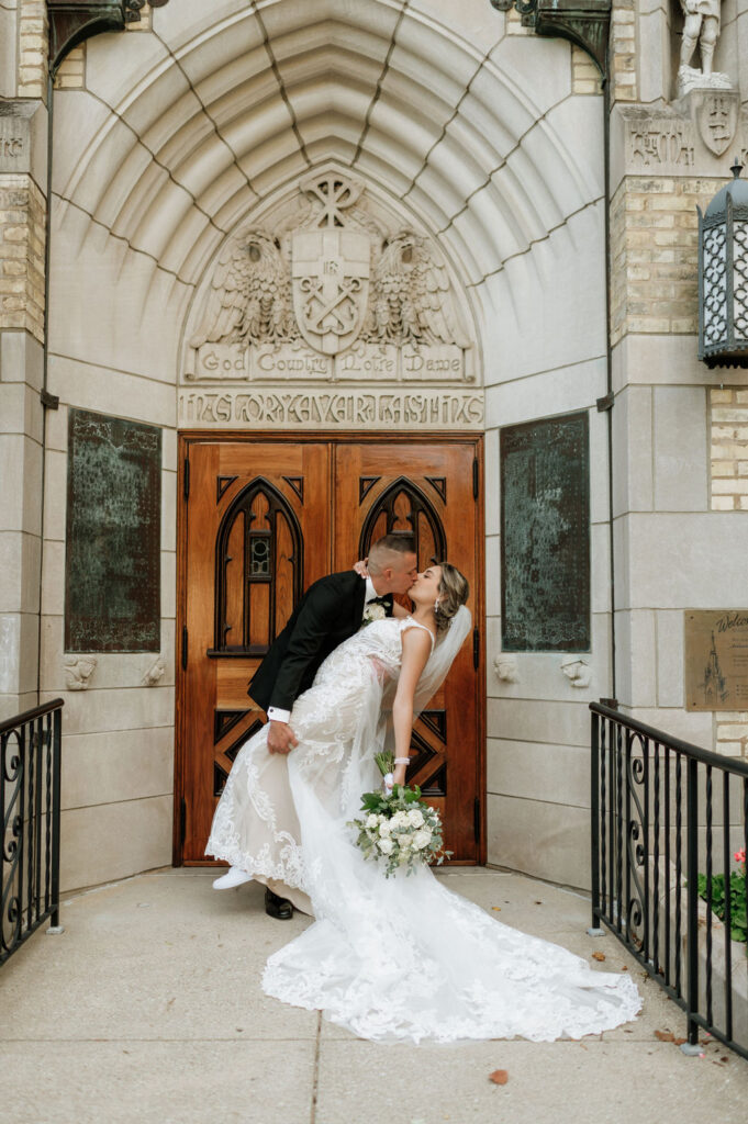 Bride and groom portraits outside of Holy Family Catholic Church