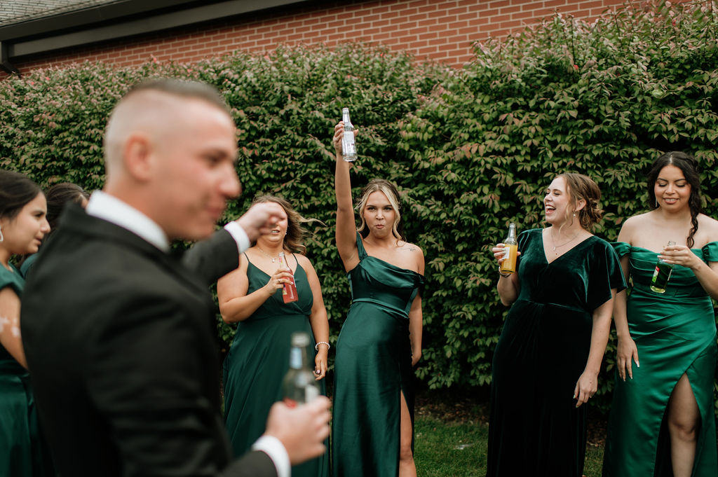 Bridesmaids getting iced by the groom