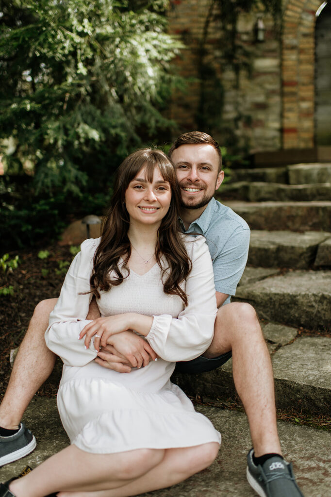 Couple sitting on steps in Indiana for their photo session
