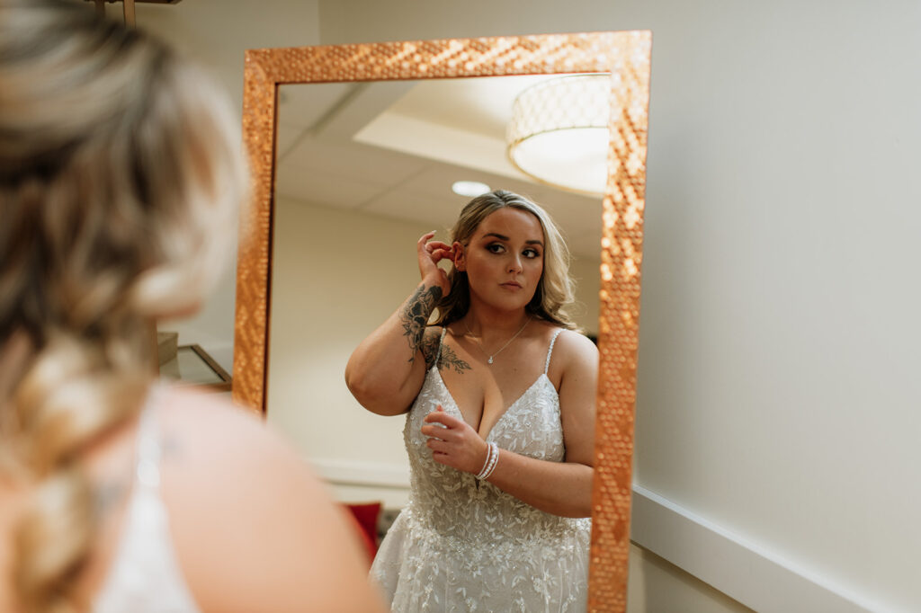 Bride looking at herself in the mirror