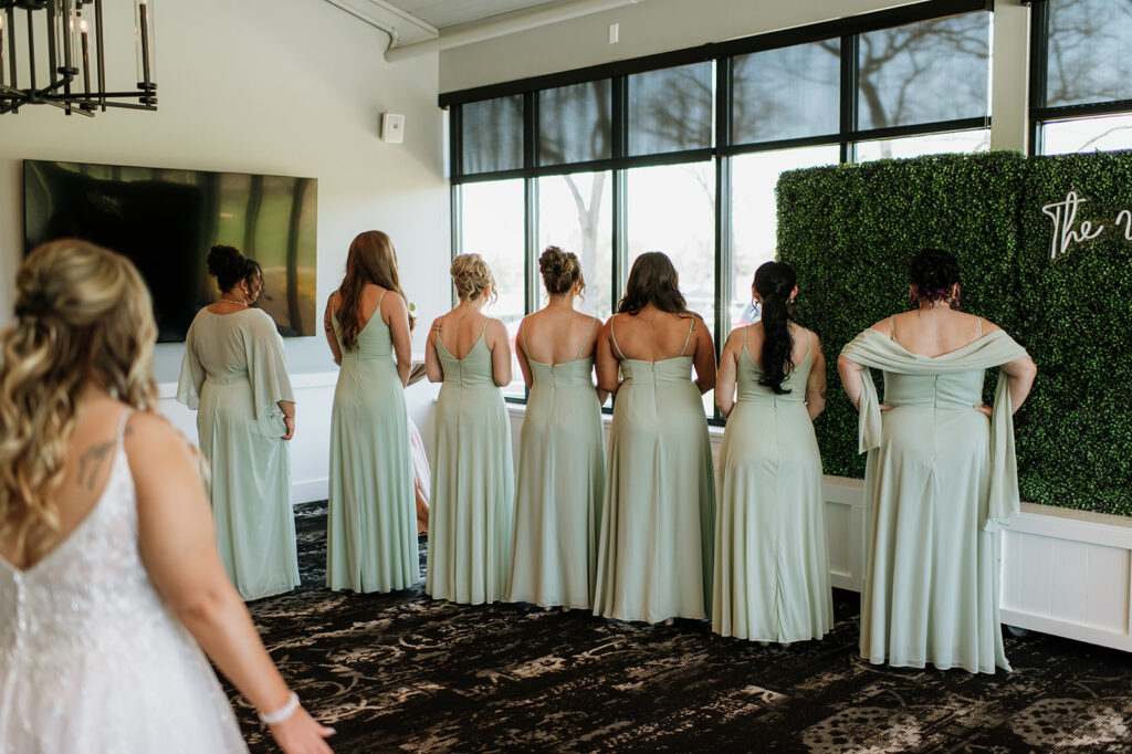 Bride about to share a first look with her bridesmaids