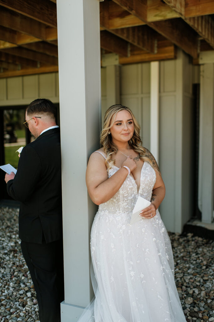 Bride getting emotional as her groom shares private vows to her during their first touch from their Morris Park Country Club wedding in South Bend, Indiana