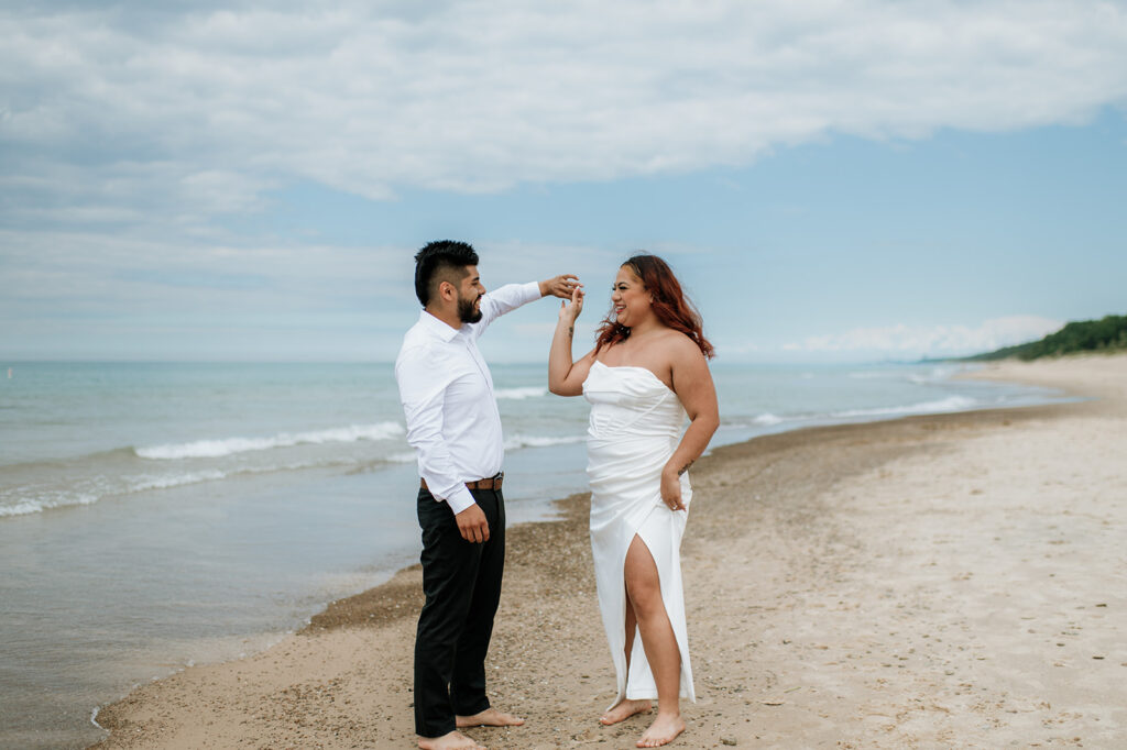 Bride and groom dancing on the beach in Indiana Dunes National Park