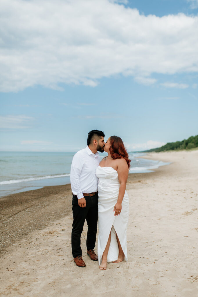 Bride and groom kissing during their beach elopement in Indiana at Indiana Dunes National Park