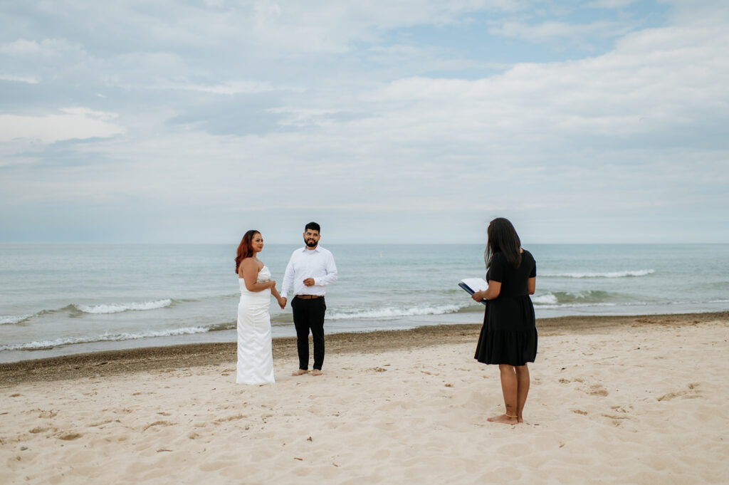 Bride and grooms intimate beach ceremony officiated by officiant-kim.com