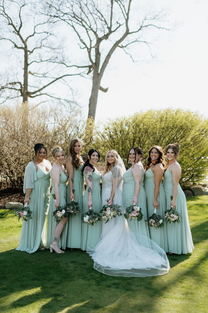 Outdoor bride and bridesmaids portraits from a Morris Park Country Club wedding in South Bend, Indiana