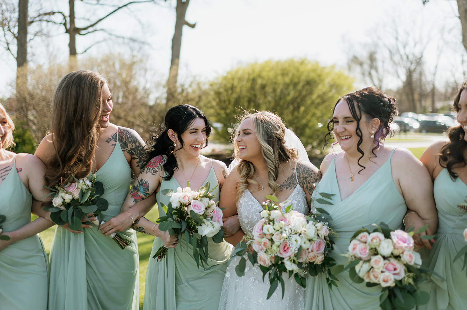 Outdoor bride and bridesmaids portraits from a Morris Park Country Club wedding in South Bend, Indiana