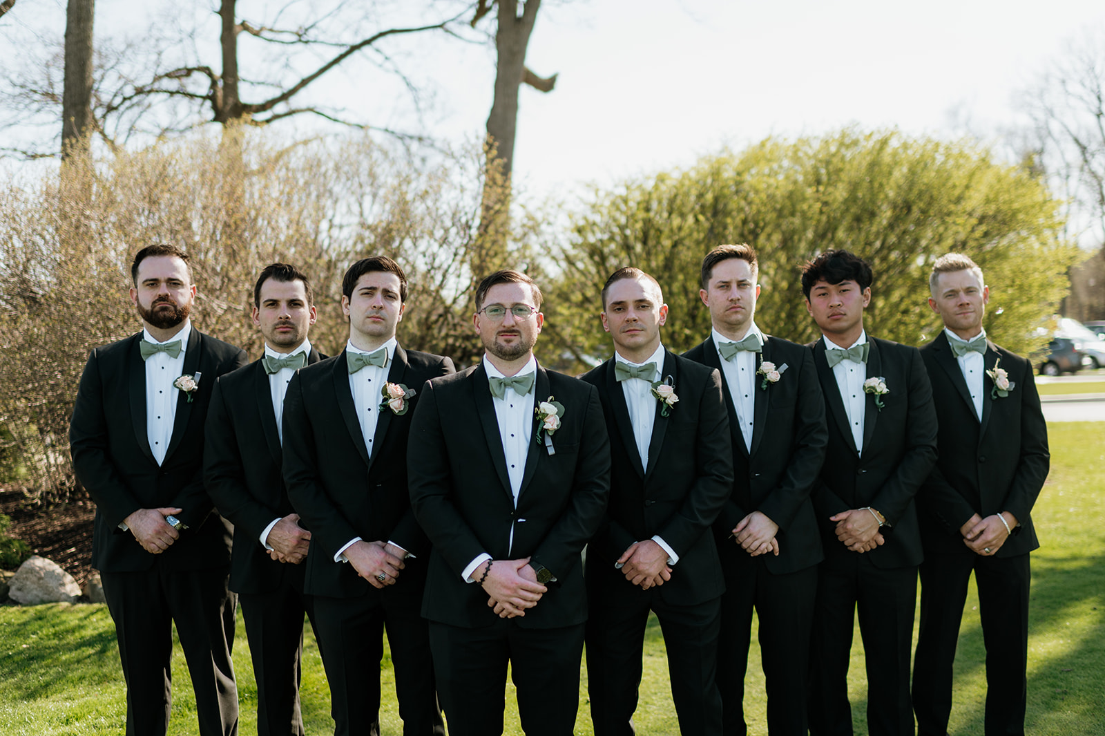 Outdoor groom and groomsman portraits from a Morris Park Country Club wedding in South Bend, Indiana