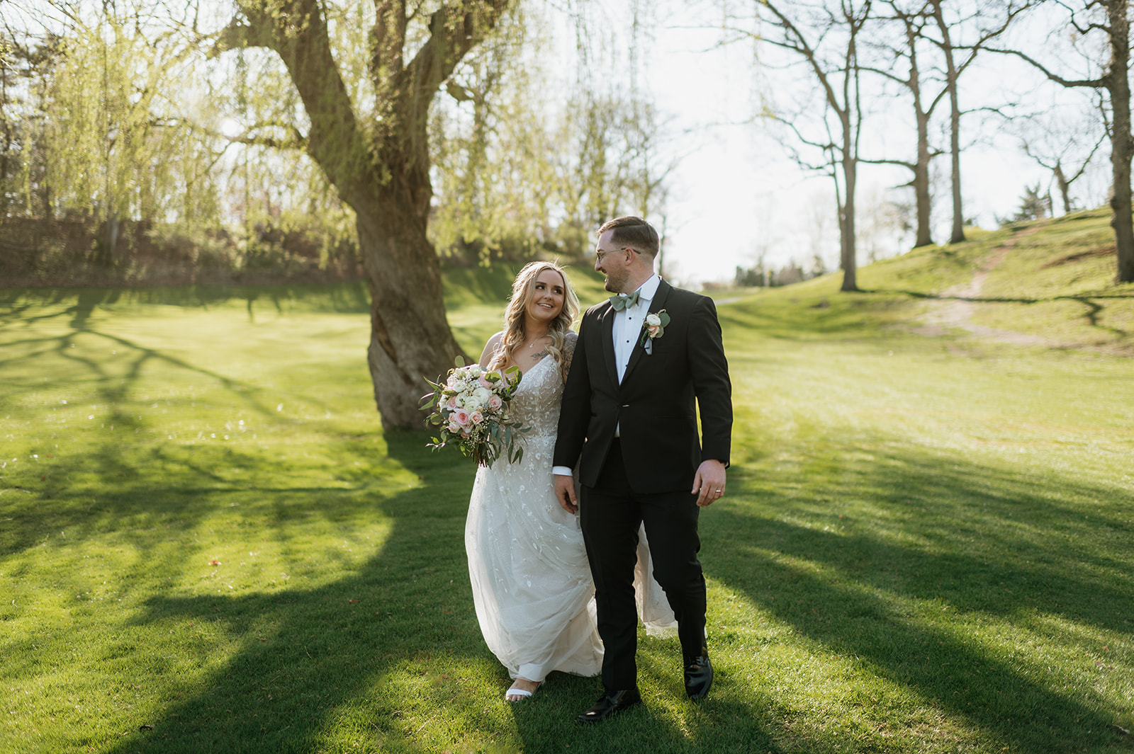 Bride and grooms outdoor portraits from their Morris Park County Club wedding in South Bend, Indiana