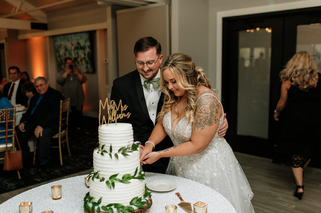 Bride and groom cutting their wedding cake