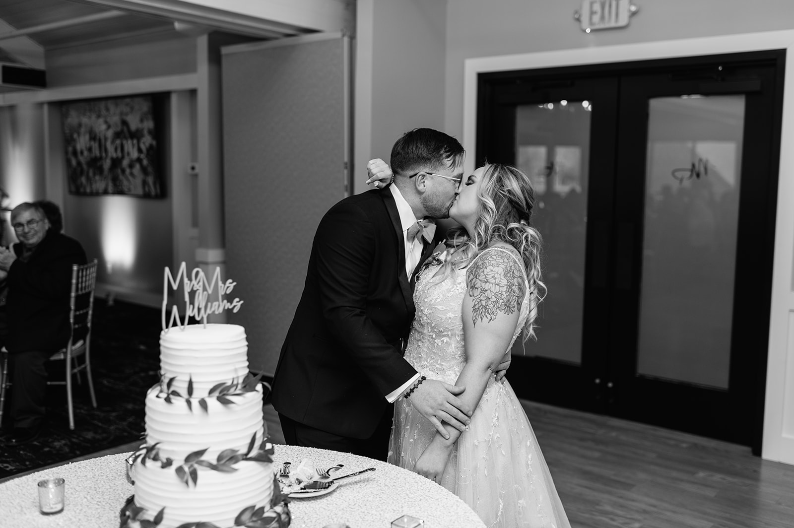 Bride and groom cutting their wedding cake