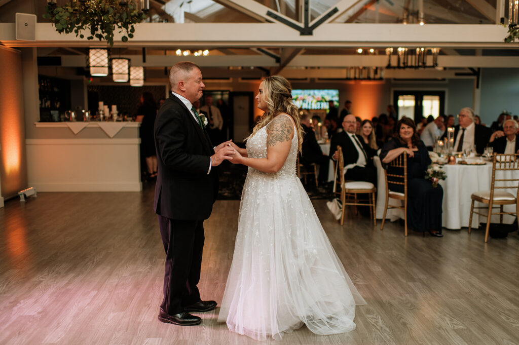 Bride and her father dancing during the reception