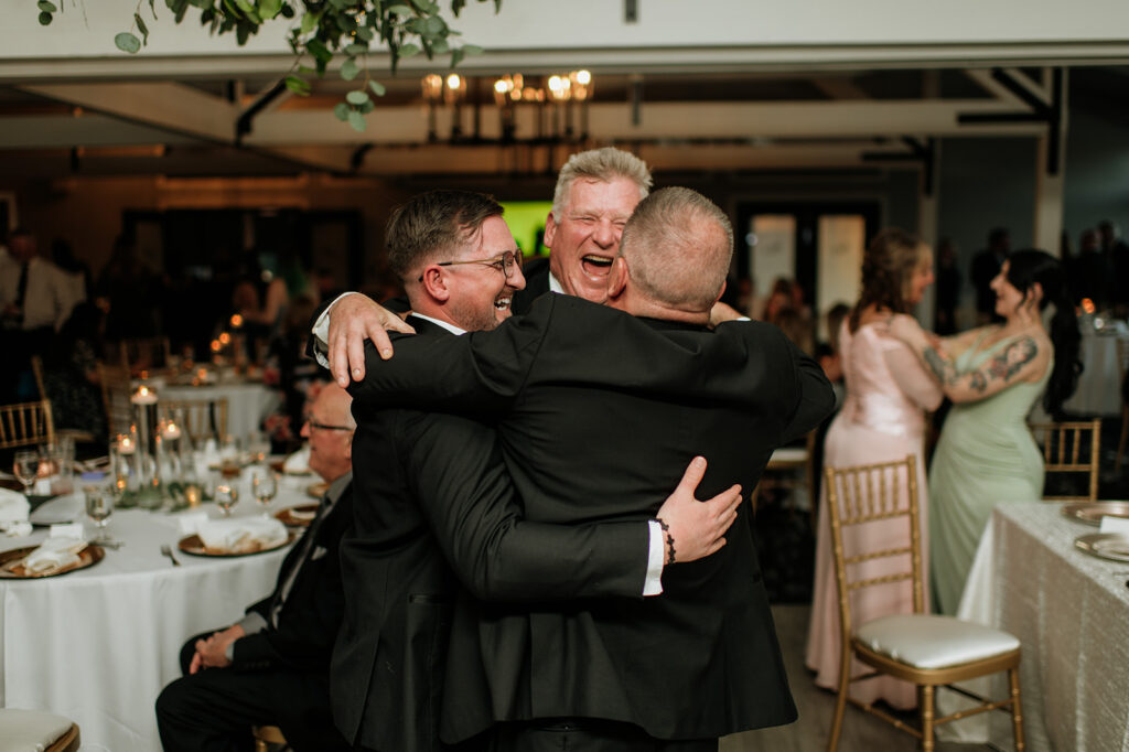 Wedding guests hugging eachother