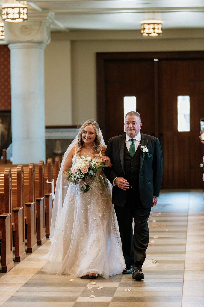 Bride and her father walking down the aisle