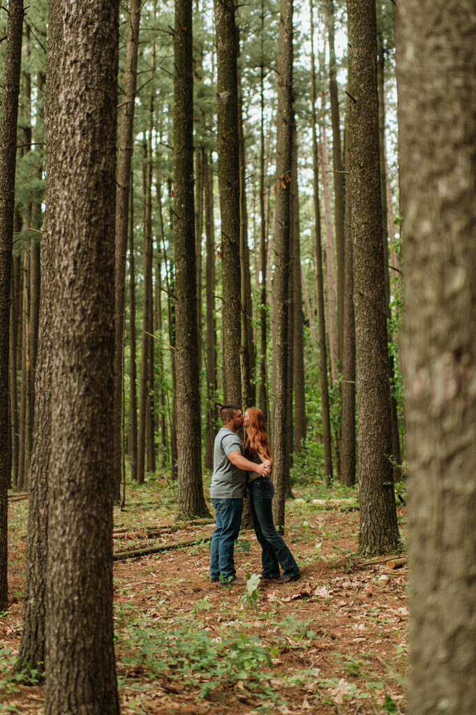 Couple kissing in the woods