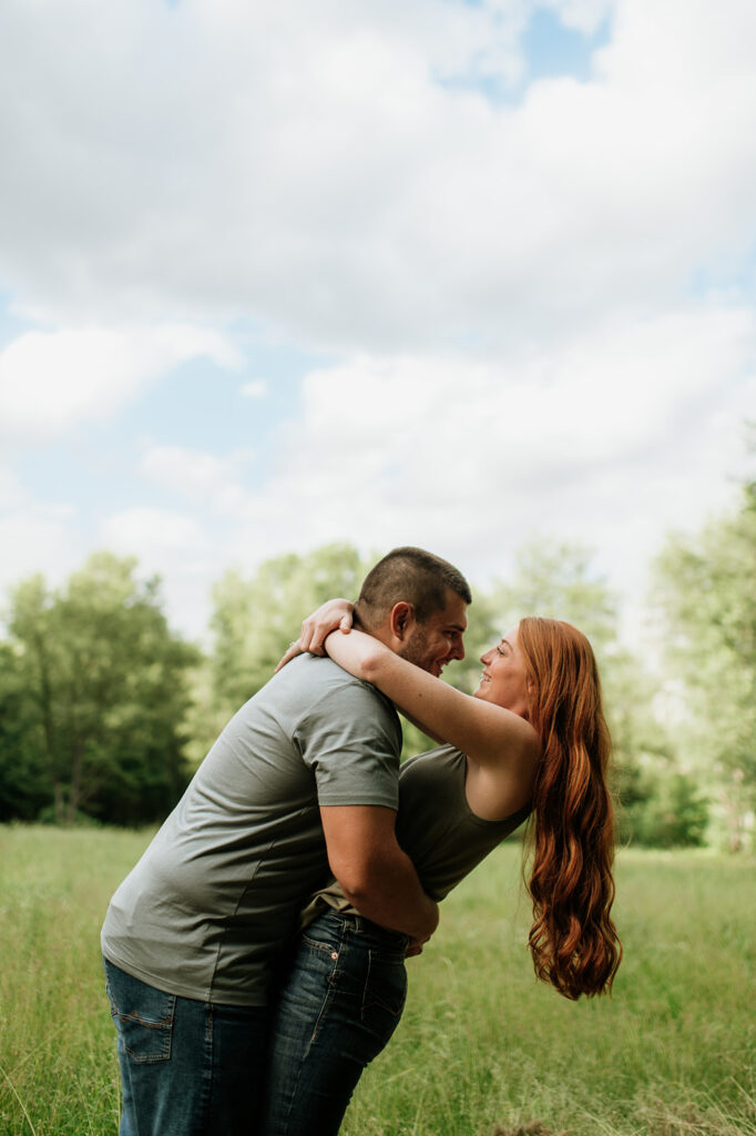 Couple being playful during their outdoor photo session