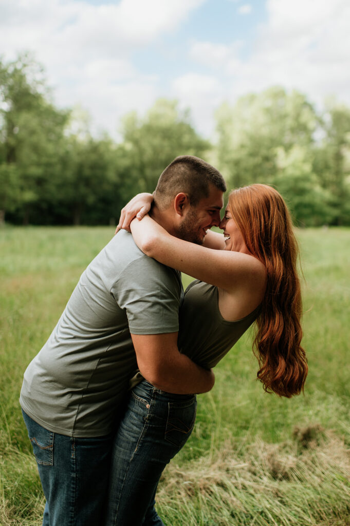 Couple being playful during their outdoor photo session