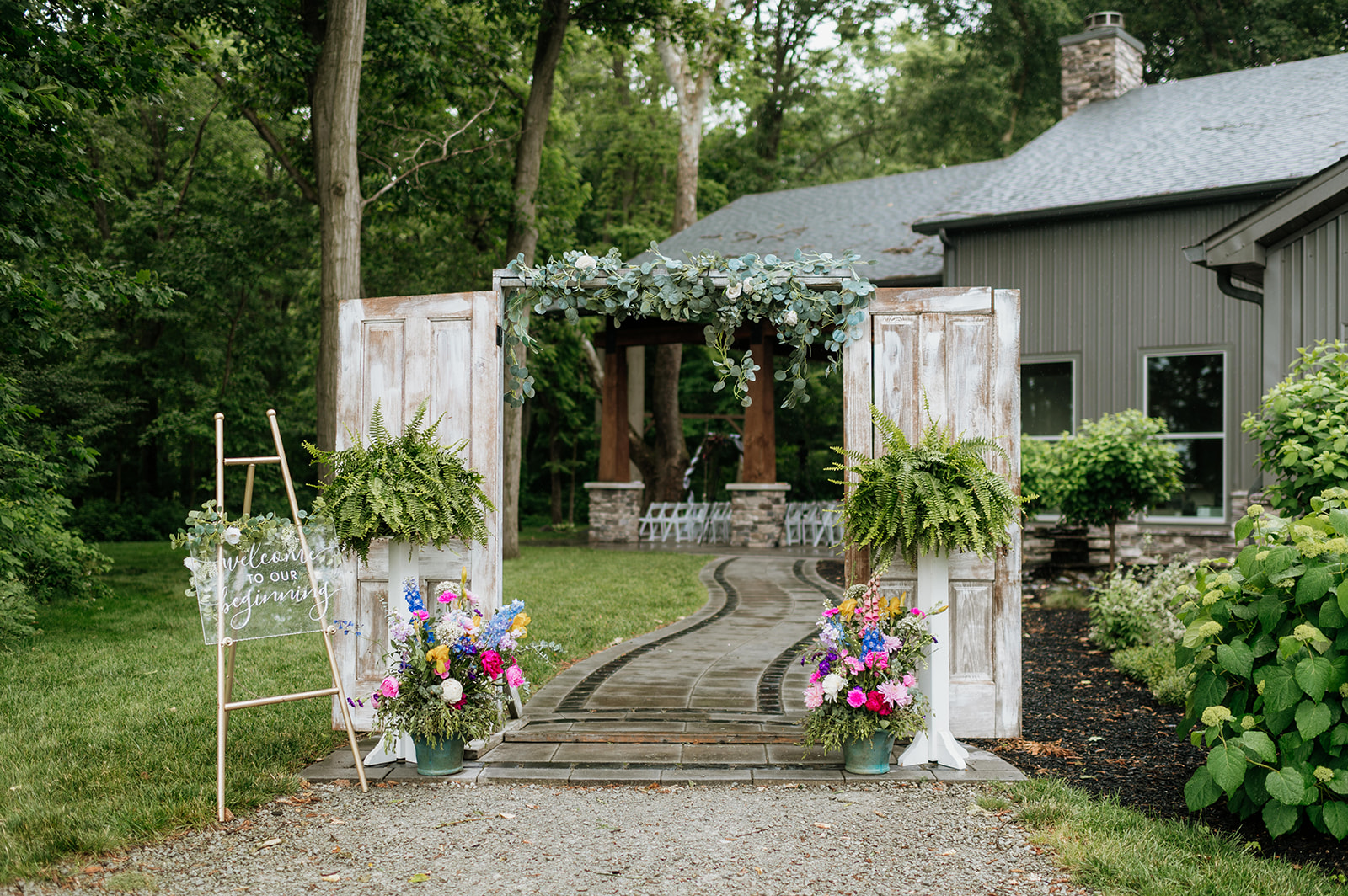 A rainy and colorful outdoor wedding ceremony on the Covered Patio at The Wooded Knot in Tippecanoe, Indiana