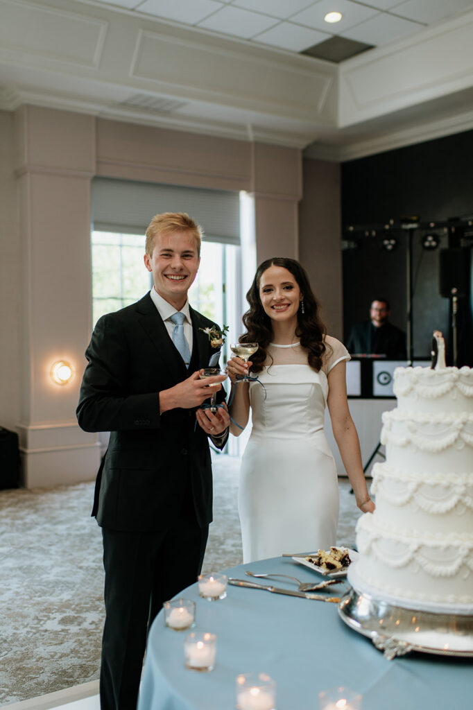 Bride and groom drinking champagne during their Ritz Charles Carmel, Indiana wedding reception in the Ginkgo Ballroom