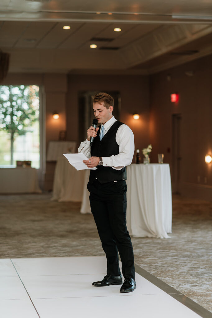 Grooms twin giving a speech during the reception