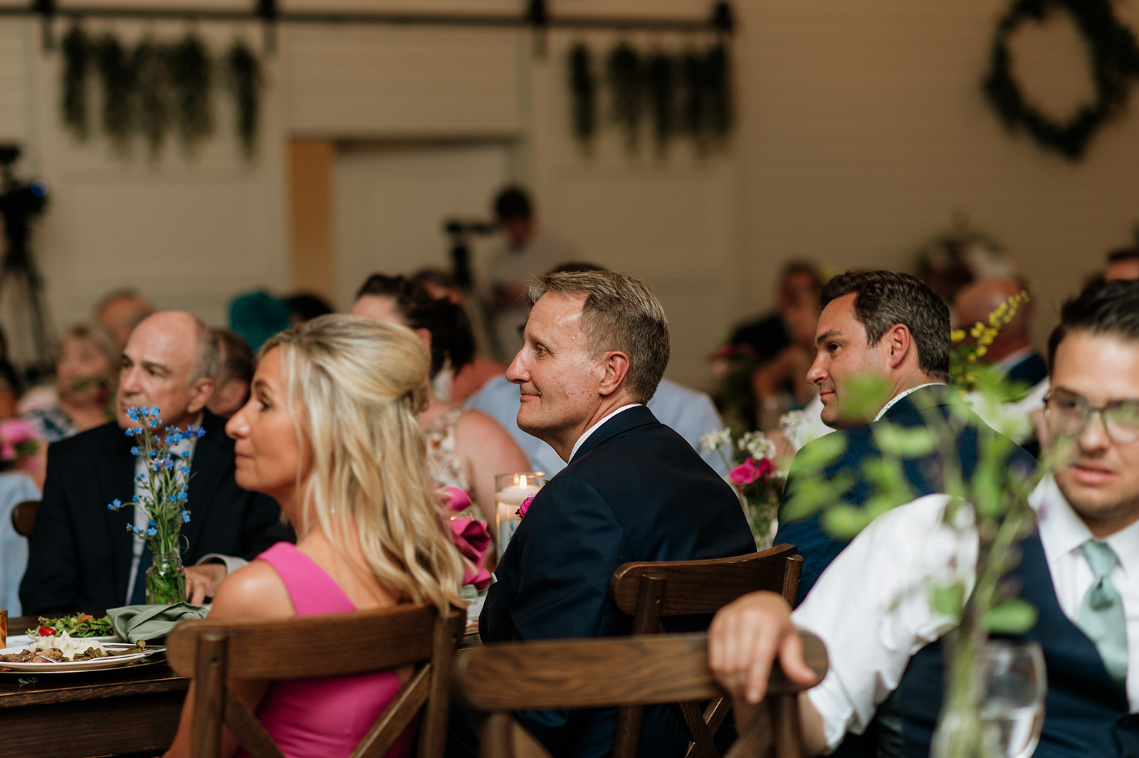 Wedding guests listening to the speeches during a reception