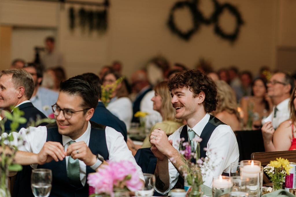 Wedding guests laughing during speeches