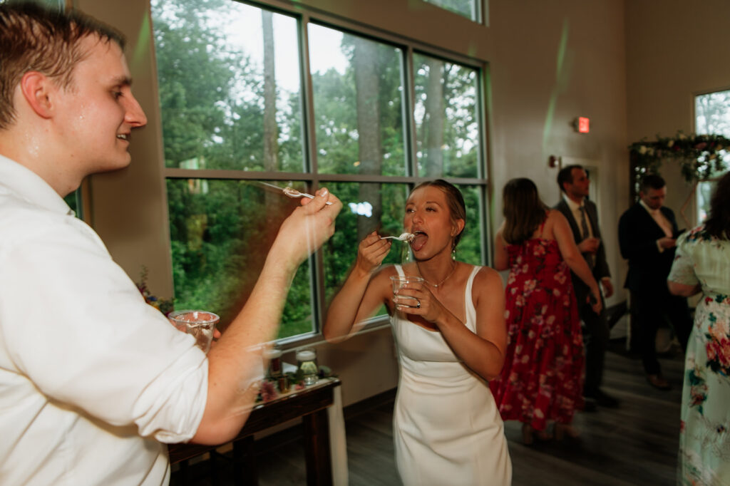 Bride and groom eating ice cream during their reception