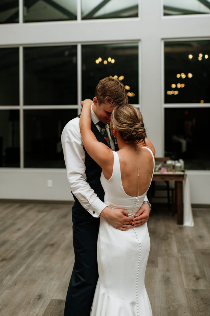 Bride and groom sharing a last private dance