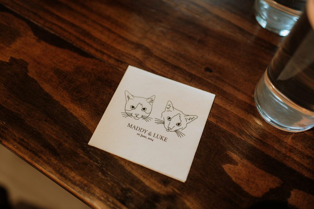 Custom cat napkins at a wedding reception