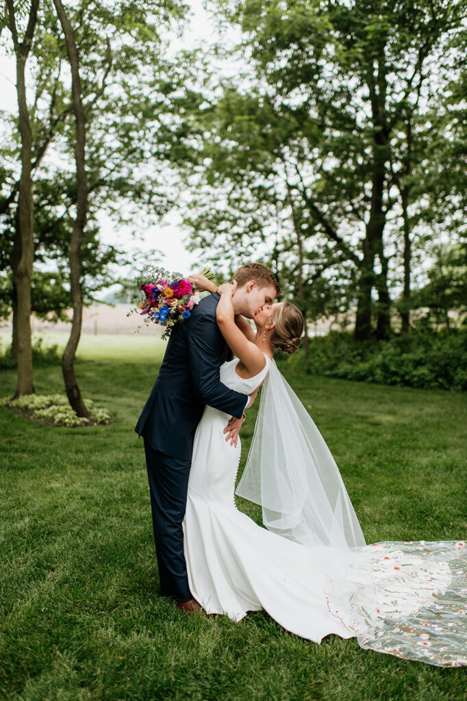 Bride and grooms outdoor wedding portraits from a colorful wildflower wedding at The Wooded Knot in Tippecanoe, Indiana