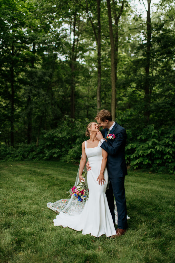 Bride and grooms outdoor wedding portraits from a colorful wildflower wedding at The Wooded Knot in Tippecanoe, Indiana