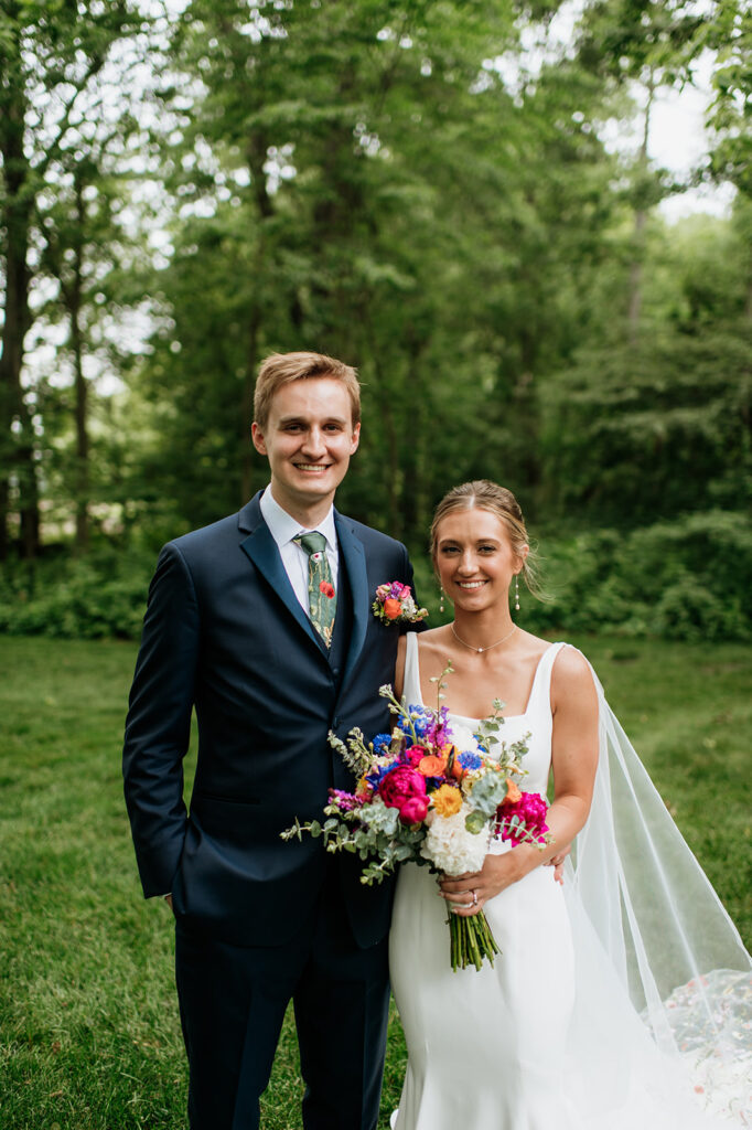 Bride and grooms outdoor wedding portraits from a colorful wildflower wedding at The Wooded Knot in Tippecanoe, Indiana