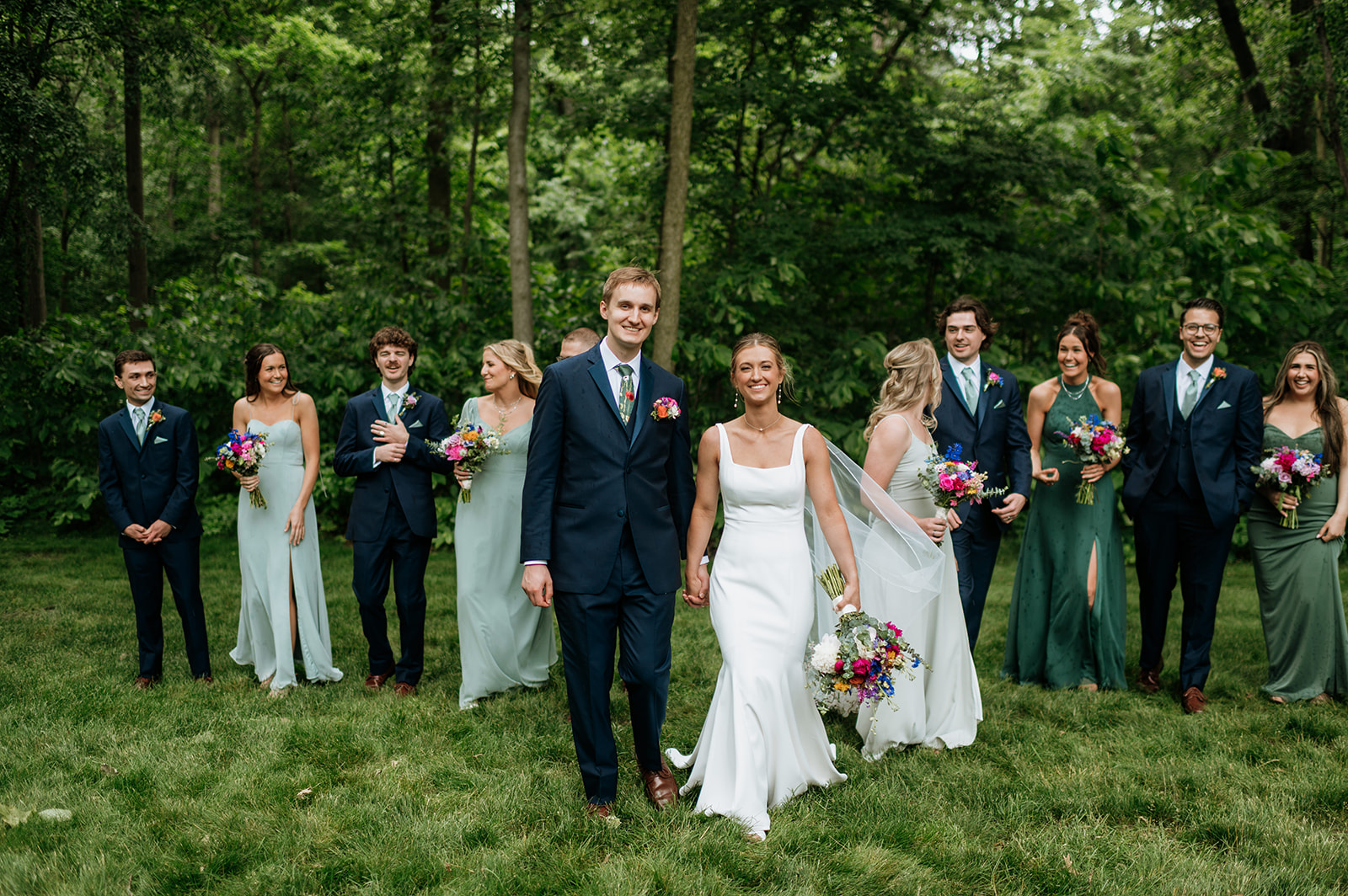 Outdoor full wedding party photos from a colorful wildflower wedding at The Wooded Knot in Tippecanoe, Indiana