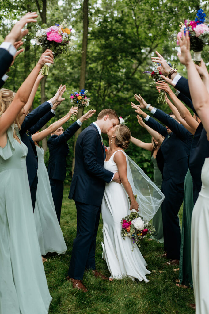 Outdoor wedding party portraits from a colorful wildflower wedding at The Wooded Knot in Tippecanoe, Indiana