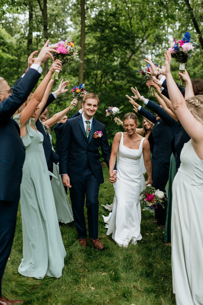 Outdoor full wedding party photos from a colorful wildflower wedding at The Wooded Knot in Tippecanoe, Indiana