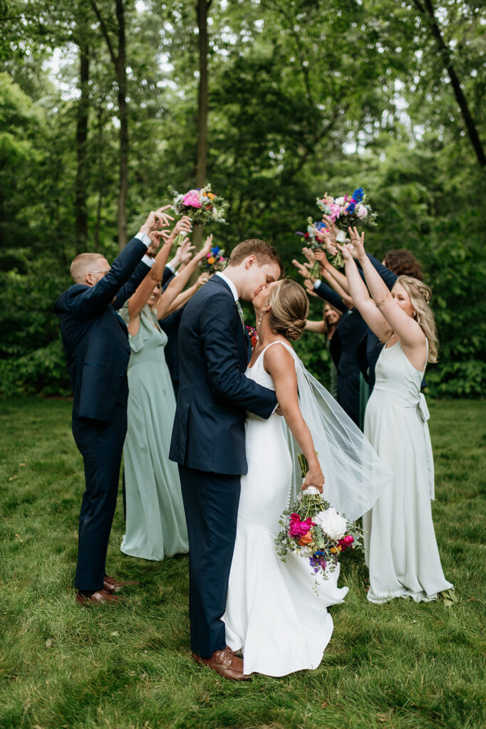 Outdoor full wedding party photos from a colorful wildflower wedding at The Wooded Knot in Tippecanoe, Indiana