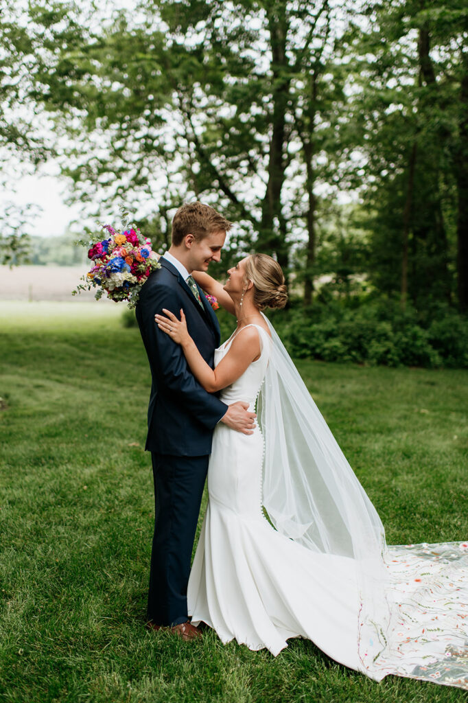 Bride and grooms outdoor wedding portraits from a colorful wildflower wedding at The Wooded Knot in Tippecanoe, Indiana