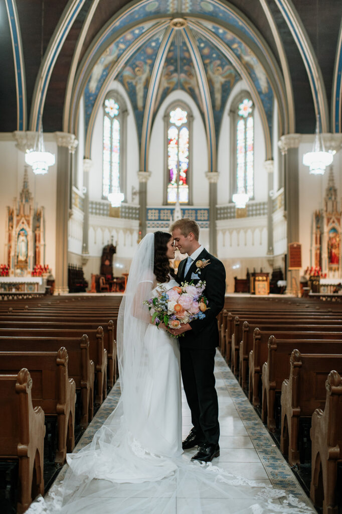 Bride and grooms portraits St. John the Evangelist Catholic Church in Indianapolis, Indiana