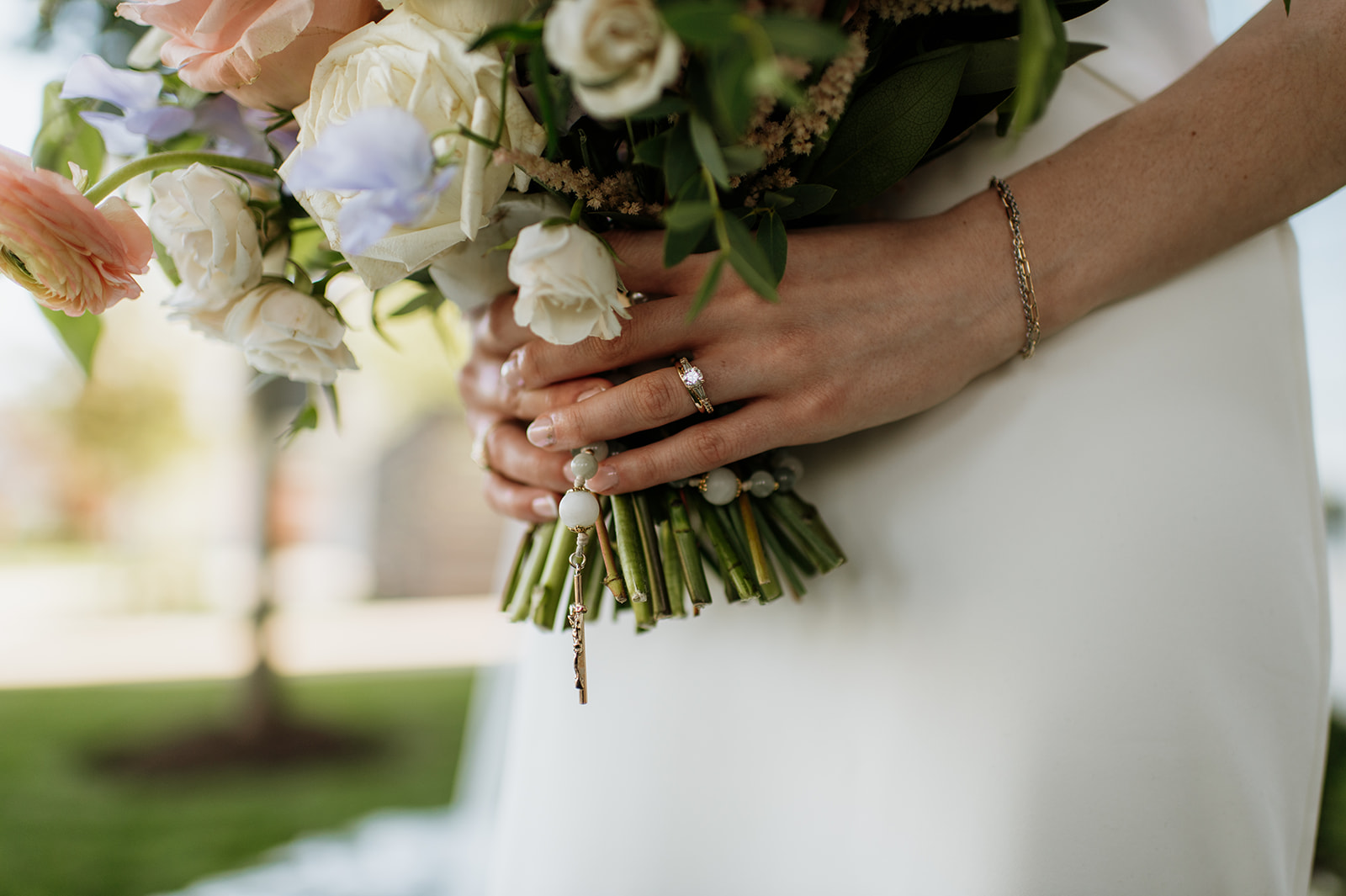 Bride holding her summer wedding bouquet