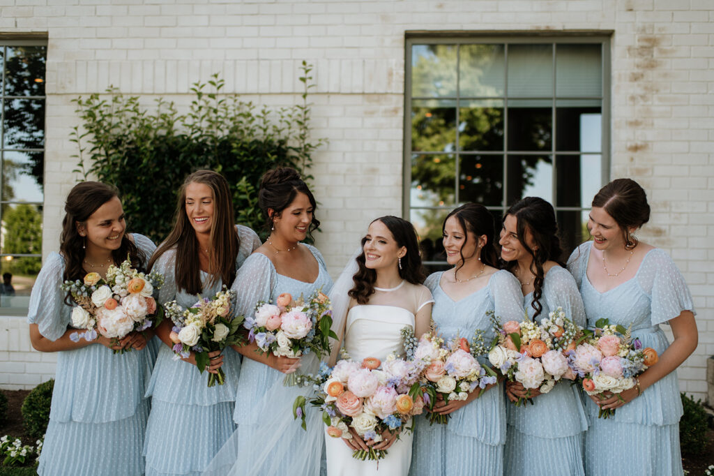 Bride and bridesmaids portraits from a summer Ritz Charles Carmel, Indiana wedding