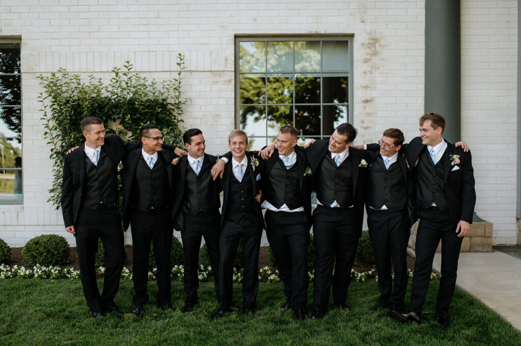 Groom and groomsmen portraits from a summer Ritz Charles Carmel, Indiana wedding