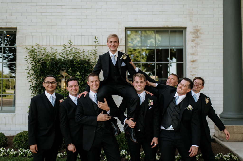 Groom and groomsmen portraits from a summer Ritz Charles Carmel, Indiana wedding