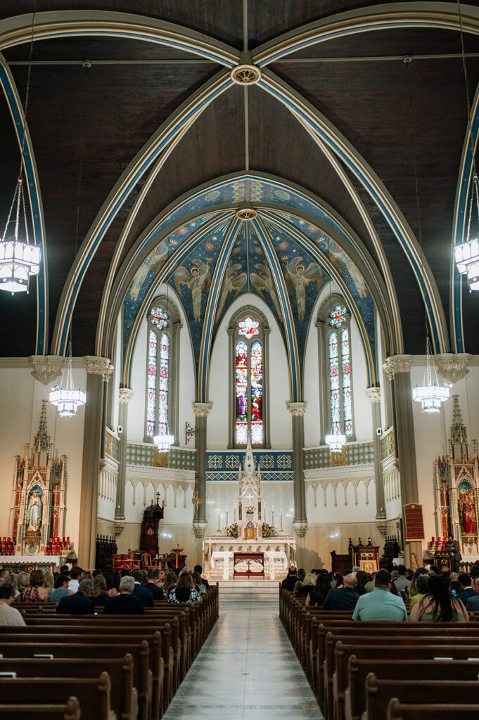 An indoor St. John the Evangelist Catholic Church wedding ceremony in Indianapolis, Indiana