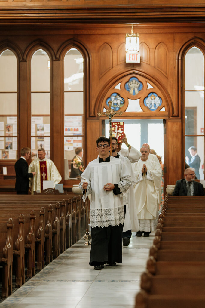 An indoor St. John the Evangelist Catholic Church wedding ceremony in Indianapolis, Indiana