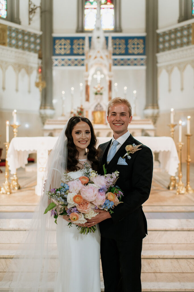 Bride and grooms wedding portraits from their St. John the Evangelist Catholic Church wedding ceremony in Indianapolis, Indiana