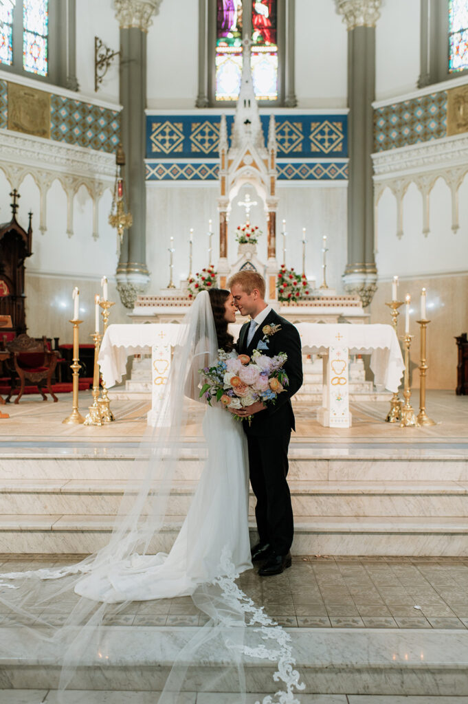 Bride and grooms wedding portraits from their St. John the Evangelist Catholic Church wedding ceremony in Indianapolis, Indiana