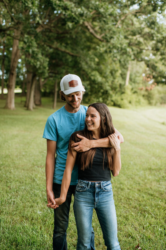 Man and woman posing for their Midwest engagement photos in Albion, Indiana