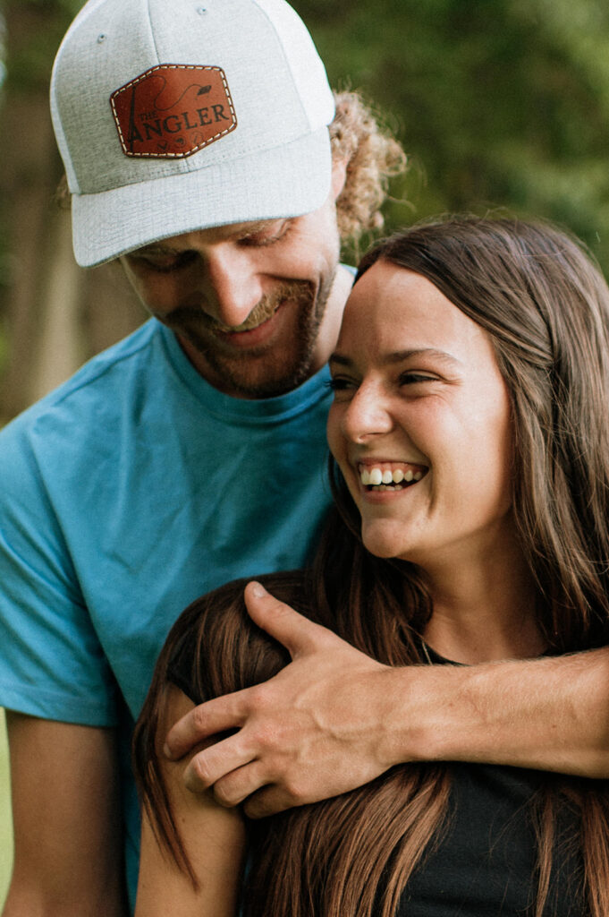 Close up photo of a man and woman laughing