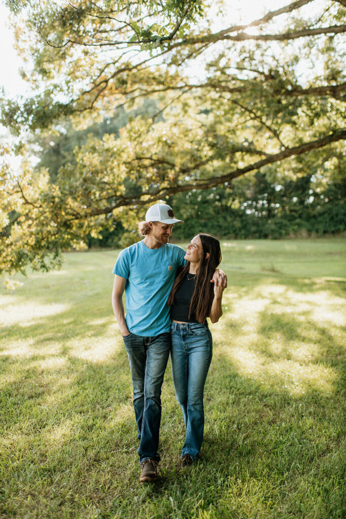 Man and woman posing for their Midwest engagement photos in Albion, Indiana