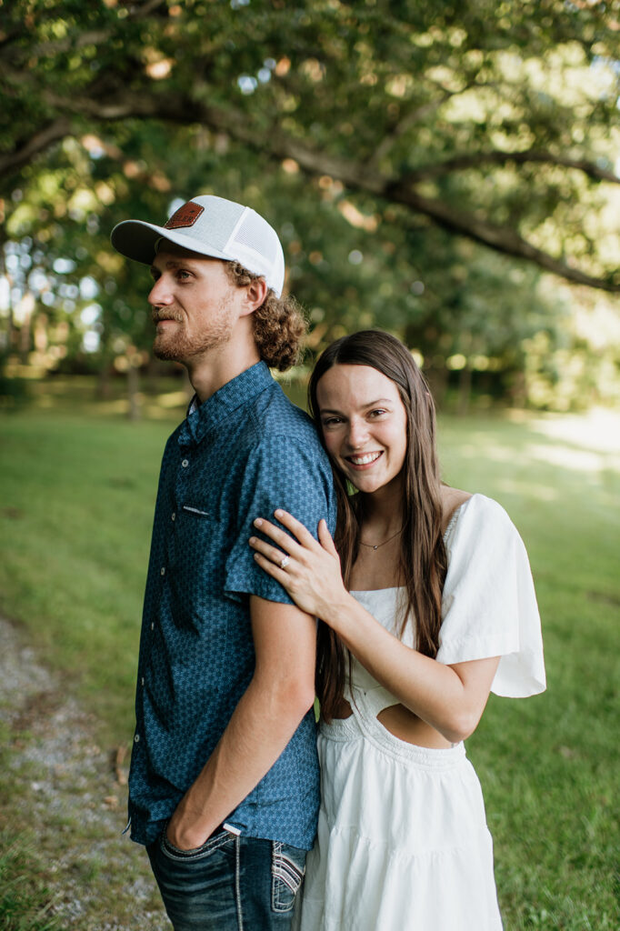 Man and woman posing for their photoshoot